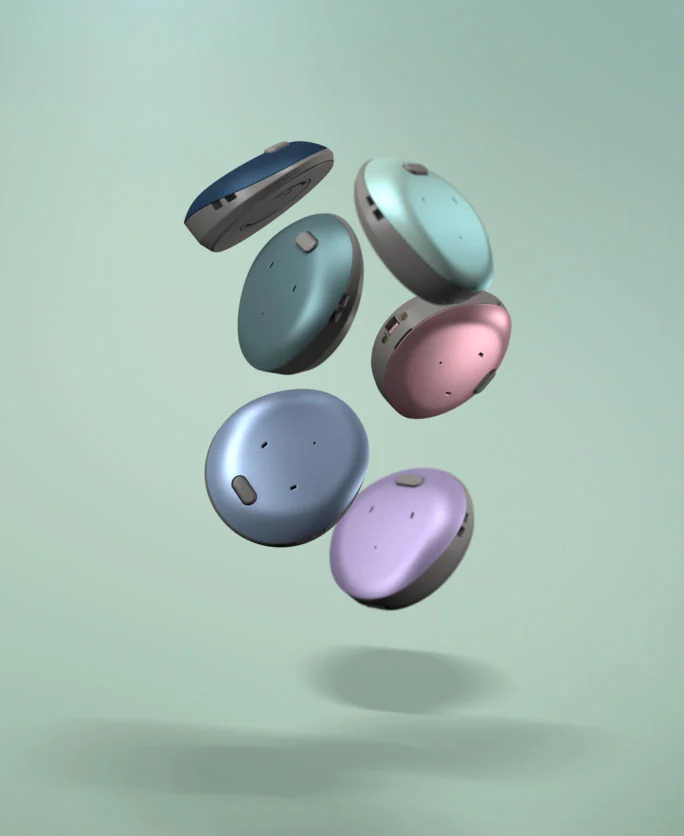 Osia 3 Sound Processors in several colour covers, floating against a sage green background